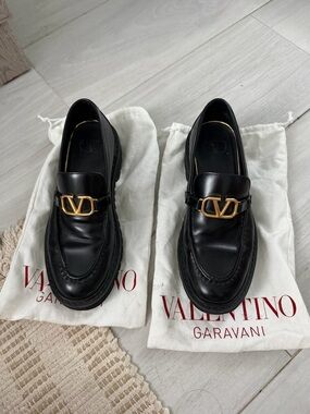 Valentino Garavani Black Leather Loafers with Gold V-Buckle
